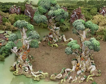 May include: A set of three 3D printed miniature trees with intricate roots and branches, painted in shades of green, brown, and white. The trees are arranged in a circle on a brown surface, creating a whimsical forest scene.