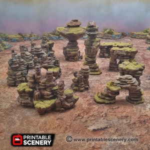 Puede incluir: Un conjunto de formaciones rocosas impresas en 3D, perfectas para juegos de mesa o modelismo. Las rocas están hechas de un material marrón claro y tienen una superficie texturizada. Están dispuestas en una variedad de formas y tamaños, con algunas que presentan arcos y otros detalles interesantes.