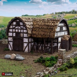 May include: A miniature medieval barn model with a thatched roof, white stucco walls, and dark brown timber framing. The model includes a stone wall and is set against a backdrop of green hills and a blue sky with clouds.