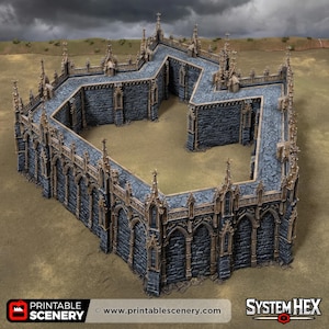 May include: A miniature gothic stone wall structure featuring dark grey masonry with weathered brown trim, pointed arches, and decorative spires along the top edge. The wall forms an enclosed, angular courtyard layout with detailed stonework textures.