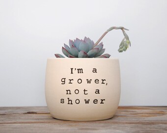 I'm a grower, not a shower. White pot with dirty humor.