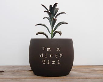 I'm a dirty girl. Black pot with dirty humor.