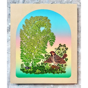 May include: A colorful art print featuring a bird with outstretched wings, perched on a log amidst green foliage and flowers. The background showcases a gradient of blue, pink, and yellow, framed by a tan border. The artwork has a whimsical, illustrative style.
