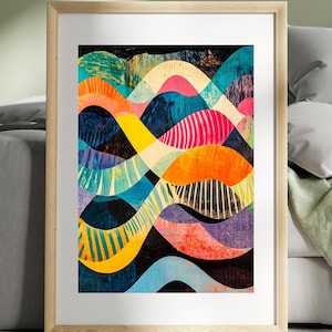 May include: Abstract art print featuring a colourful design of overlapping waves in shades of blue, green, yellow, orange, pink, and black. The print is framed in a light wood frame.