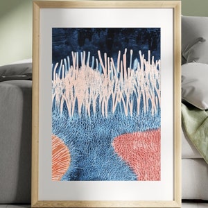 May include: Abstract art print in a wooden frame. The artwork features a dark blue background with white vertical lines, light blue textured area, and coral-colored shapes. The framed art is displayed against a green wall and a gray sofa.