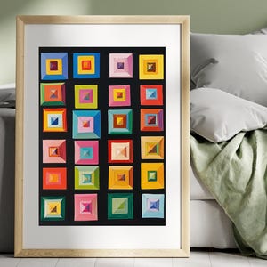 以下が含まれることがあります： 黒い背景にカラフルな幾何学的な正方形のグリッドが描かれた額入りのアートワーク。各正方形には、より小さなマルチカラーの正方形が含まれています。アートワークは、インテリア装飾に適した明るい色の木製フレームに表示されています。