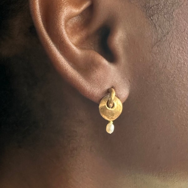 Women’s 24K gold plated tiny freshwater pearl drop earrings.