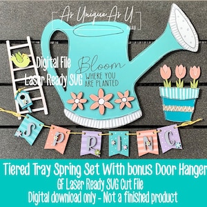 May include: A tiered tray spring set with a bonus door hanger. The set includes a blue watering can with the text "Bloom Where You Are Planted", a ladder with a birdhouse and a bird, a flower pot with three pink flowers, and a banner that says "Spring".