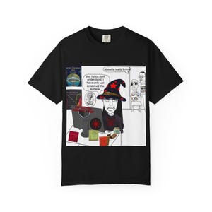 May include: Black t-shirt featuring a cartoon image of a person wearing a witch hat and glasses, with text bubbles. The text bubbles say "you hylics dont understand, I have only just scratched the surface" and "dinner is ready timmy".