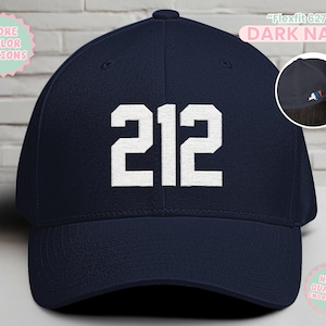 May include: Dark navy baseball cap with the number "212" in white block letters. The cap has a curved brim and a structured fit. The text "Flexfit 6277" and "Dark Navy" are printed on the top right of the cap.