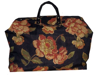 Bolso de mano con tapiz tejido en negro y flores rojas