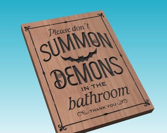 May include: A wooden sign with a black border and a black inscription that reads "Please don't summon demons in the bathroom. Thank you."