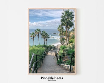 May include: A photo print of a stairway leading down to a beach with palm trees and ocean in the background. The print has a wooden frame and the text "PinnablePlaces by Wallency" at the bottom.
