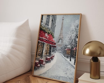 May include: A framed painting depicts a snowy Parisian street scene with the Eiffel Tower in the background. A cafe with a red awning and tables is on the left. The artwork is in a wooden frame.