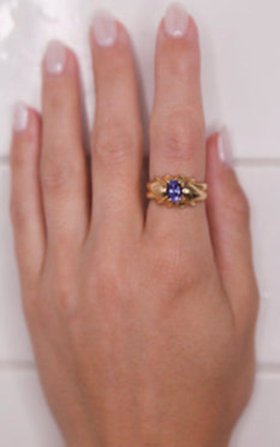 Gold ring with purple tanzanite