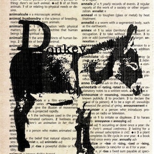 Puede incluir: Una imagen en blanco y negro de la palabra "donkey" impresa en negrita, en letras grandes. La palabra está superpuesta sobre una página de diccionario con definiciones de palabras como "animal", "tobillo", "anular" y "anulación".