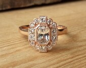 Emerald Cut Sapphire and Diamond Halo Ring