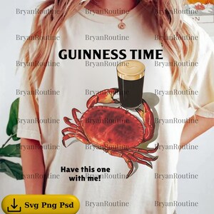 a person wearing a white t-shirt with a graphic design of a red crab and a glass of beer.