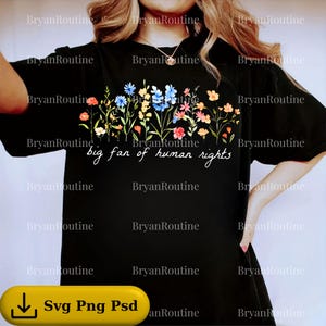 May include: Black t-shirt featuring a colourful floral design with red, blue, and yellow flowers. The text "big fan of human rights" is written in white script. A casual wear item.