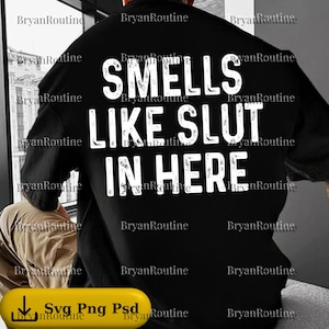 May include: Black oversized t-shirt with the text "SMELLS LIKE SLUT IN HERE" in white block letters. The shirt is a casual style, suitable for everyday wear.