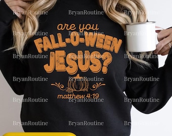 May include: Black sweatshirt with the text "are you FALL-O-WEEN JESUS?" in orange, along with a pumpkin graphic and the Bible verse Matthew 4:19. A white mug is held in the hand.