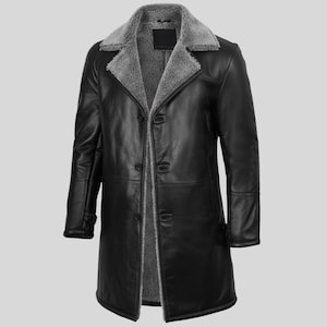 May include: A black leather coat featuring a grey shearling collar and lining. The long coat has a button-up front and long sleeves. A classic outerwear item for cold weather.