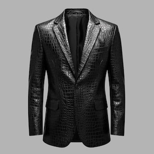 May include: A black blazer with a crocodile-skin effect. The jacket features a notched lapel, two front pockets, and a single-button closure. The tailored blazer is a classic design.