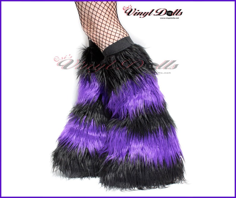 May include: Purple and black faux fur leg warmers. The leg warmers are striped with alternating bands of purple and black fur.