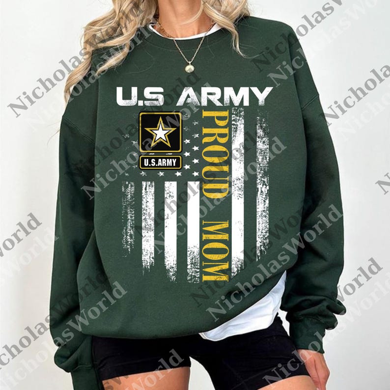 A woman wearing a green sweatshirt with a graphic design that says "U.S. Army Proud Mom" printed on it.