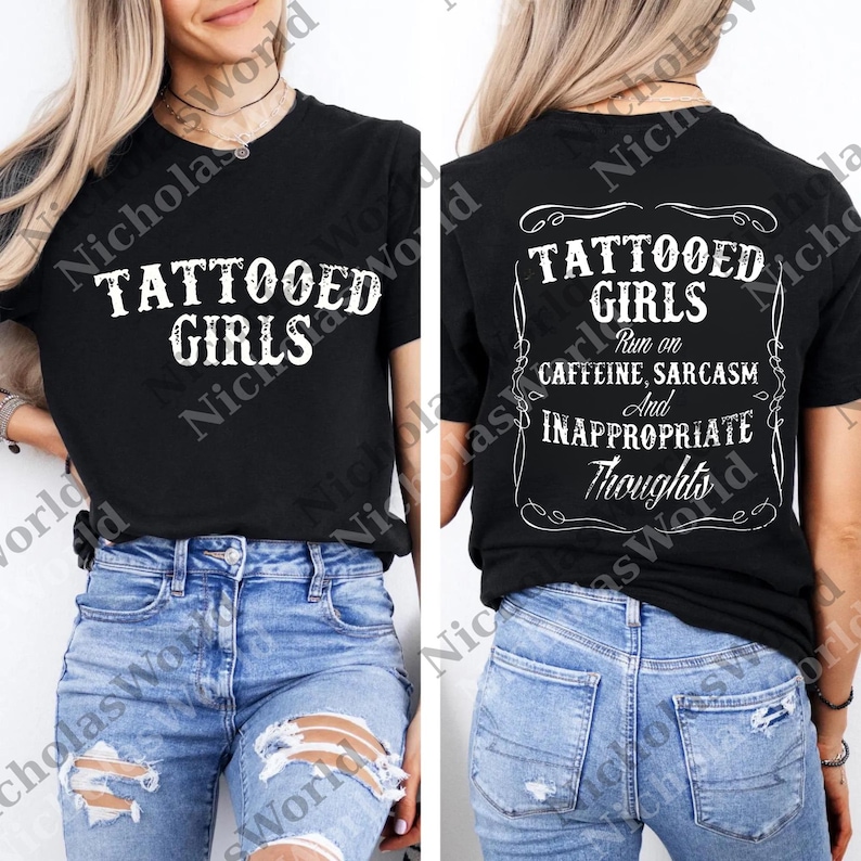 A woman wearing a black t-shirt with white text and a graphic design on the back.