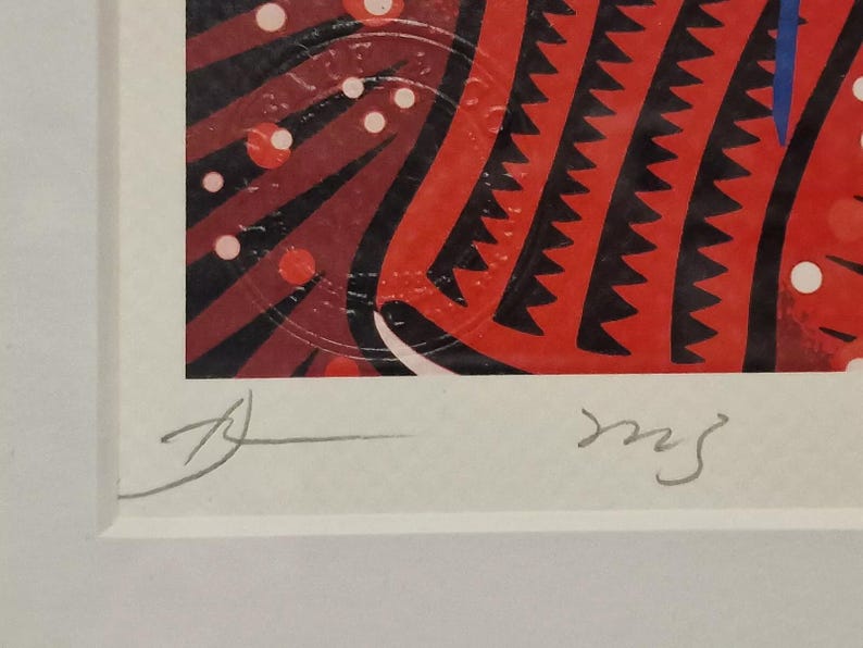 May include: A framed print of a colorful abstract art piece with red, black, and white geometric shapes. The print is signed "ms" in the bottom right corner.
