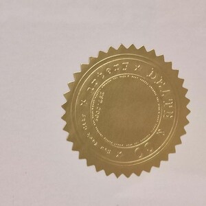 May include: A gold foil seal with a circular design and the text "DEALERS CHOICE" around the edge.