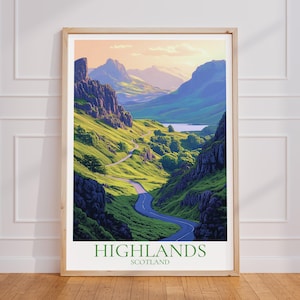 Op de afbeelding: Een ingelijste print met een schilderachtig uitzicht op de Schotse Hooglanden. Het kunstwerk toont een kronkelende weg door een vallei met weelderige groene heuvels en torenhoge rotsformaties. De print bevat de tekst "HIGHLANDS SCOTLAND".