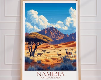 May include: A framed poster with a colorful illustration of a desert landscape in Namibia. The poster features a mountain range, a blue sky with white clouds, and a group of oryx in the foreground. The text "Namibia National Park" is printed at the bottom of the poster.