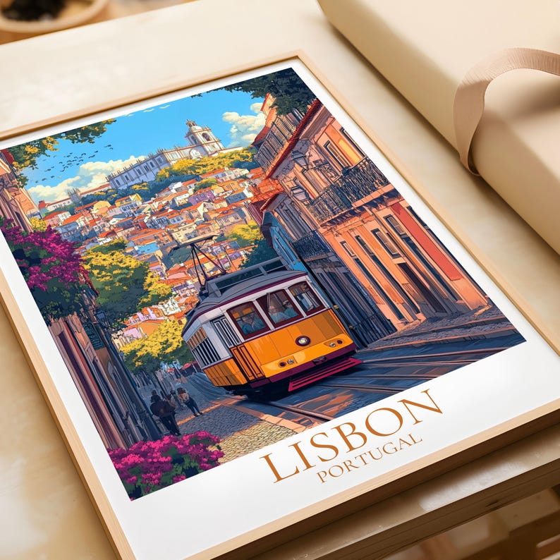 May include: A framed art print depicting Lisbon, Portugal, with a yellow tram on a steep street. The image shows vibrant buildings, a blue sky, and the words "LISBON PORTUGAL" at the bottom. The print is presented in a wooden frame.