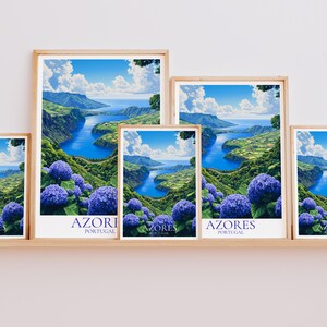 May include: Five framed art prints featuring a scenic landscape of the Azores, Portugal. The artwork depicts a blue river winding through green hills, with vibrant blue hydrangeas in the foreground. Each print is in a wooden frame.