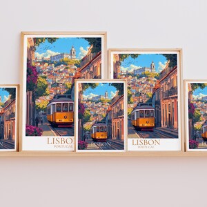 May include: A collection of framed art prints displaying a colourful illustration of a yellow tram in Lisbon. The artwork depicts a street scene with buildings, a blue sky, and the text "LISBO PORTUGAL".