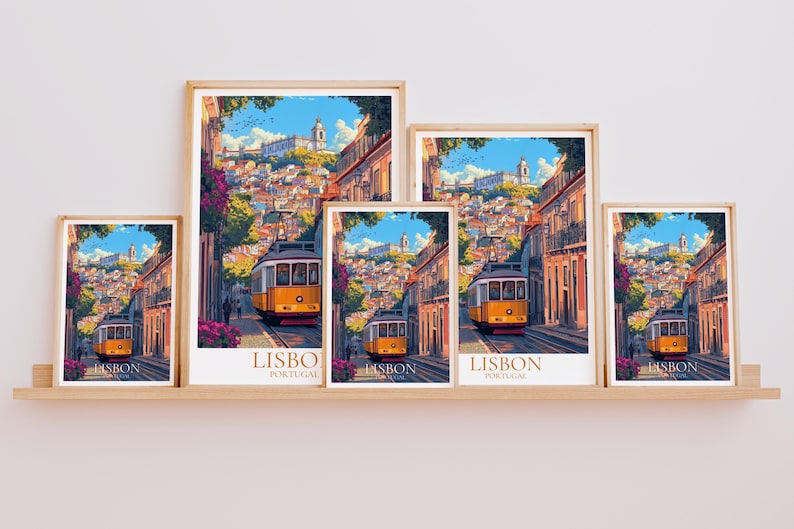 May include: A collection of framed art prints displaying a colourful illustration of a yellow tram in Lisbon. The artwork depicts a street scene with buildings, a blue sky, and the text "LISBO PORTUGAL".