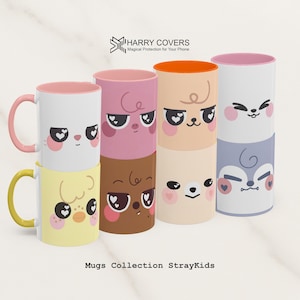 Könnte beinhalten: Sammlung von Keramikbechern mit Cartoon-Tiergesichtern. Die Becher sind in verschiedenen Farben erhältlich, darunter Rosa, Gelb, Weiß und Braun. Jeder Becher hat ein anderes Tiergesicht-Design mit herzförmigen Augen. Die Becher haben ein rosa oder orangefarbenes Innenleben.