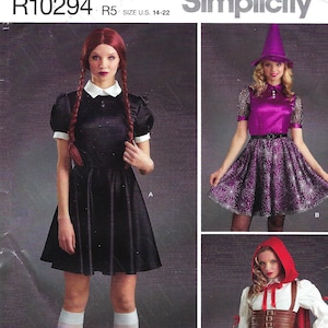 May include: A sewing pattern for three Halloween costumes: a black dress with a white collar, a purple dress with a spiderweb pattern, and a red dress with a brown vest and a red hood. The pattern is for sizes US 14-22.