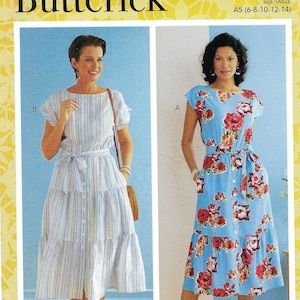 May include: Butterick sewing pattern R10556 features two women's dresses. One dress is light blue with a floral print, the other is striped. Both dresses have a button-down front, a tie belt, and short sleeves. The pattern size is A5 (6-8-10-12-14).