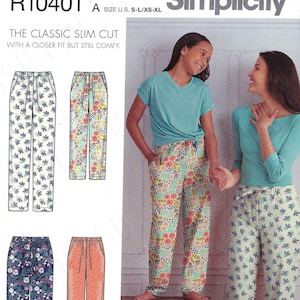 May include: Simplicity sewing pattern number R10401 for a classic slim cut pair of pants. The pattern includes four different fabric options, including floral and geometric prints. The pattern is for sizes S-L/XS-XL.