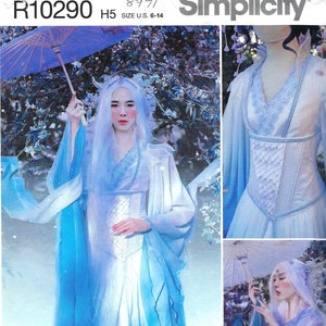May include: A Simplicity sewing pattern for a white and blue dress with a corset bodice. The pattern number is R10290 and the size is US 6-14. The pattern is for a dress with a long, flowing skirt and a fitted bodice. The dress is decorated with lace and embroidery. The pattern is from the Firefly Path collection.