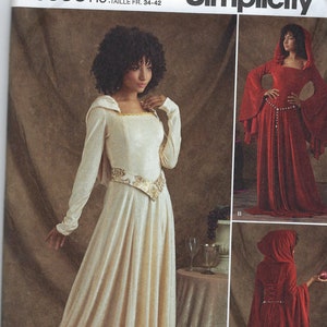 May include: Simplicity sewing pattern number S8866 H5 for a hooded gown with a beaded girdle. The pattern includes two different styles, one in white and one in red. The pattern is for sizes US 6-14, Euro 32-40, and French 34-42.