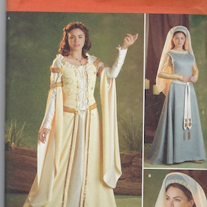 Puede incluir: Un patrón de costura para dos vestidos de estilo medieval. El patrón es para las tallas K5, 8, 10, 12, 14 y 16. El patrón es de Simplicity y el número de patrón es 2573.