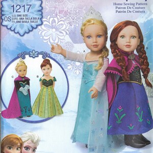 May include: Simplicity sewing pattern 1217 for making Frozen doll clothes. The pattern includes instructions for making a blue and white dress, a purple and green dress, and a purple cape. The pattern is designed for 18-inch dolls.
