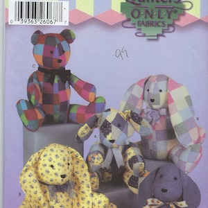 May include: Simplicity quilting pattern featuring stuffed animal designs. The pattern includes a bear, two bunnies, and two dogs. The animals are made from patchwork fabric in various colors and patterns. The pattern is labeled "One Size".