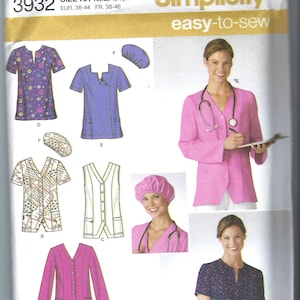 May include: Simplicity sewing pattern for medical scrubs and jackets. The pattern includes various styles of tops, vests, and jackets in different colors and patterns. The image also features a woman wearing a pink scrub jacket and cap.