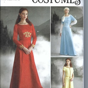 May include: Simplicity Costumes sewing pattern number S9812 for sizes US 6-14, Euro 32-40, and French 34-42. The pattern includes three different dress designs: a red dress with gold embroidery, a light blue dress with a white collar, and a yellow dress with a brown belt. The pattern is labeled "easy-to-sew" and is designed and printed in the USA.