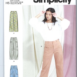 May include: Simplicity sewing pattern R11327, size US 6-14, Euro 32-40, French 34-42, for pants with pockets. The pattern includes three different styles: A - floral print, B - khaki, and C - blue denim.